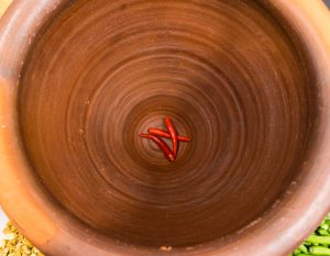 Thai chilies in a clay mortar