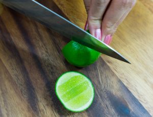 Slicing lime for som tam salad