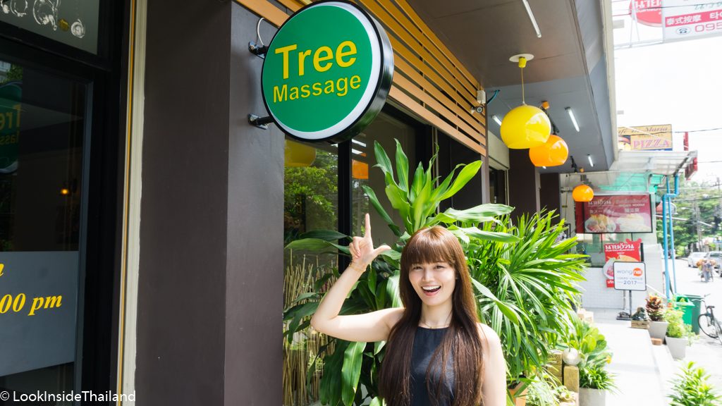 girls pointing at a sign Tree Massage