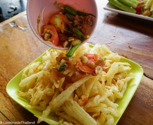 Thai food som tam poo papaya salad deep fried with spicy toppings 