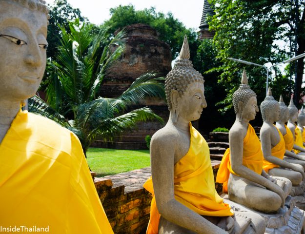 Buddhas lined up in a roll in a temple in Ayutthaya Thailand