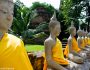 Buddhas lined up in a roll in a temple in Ayutthaya Thailand
