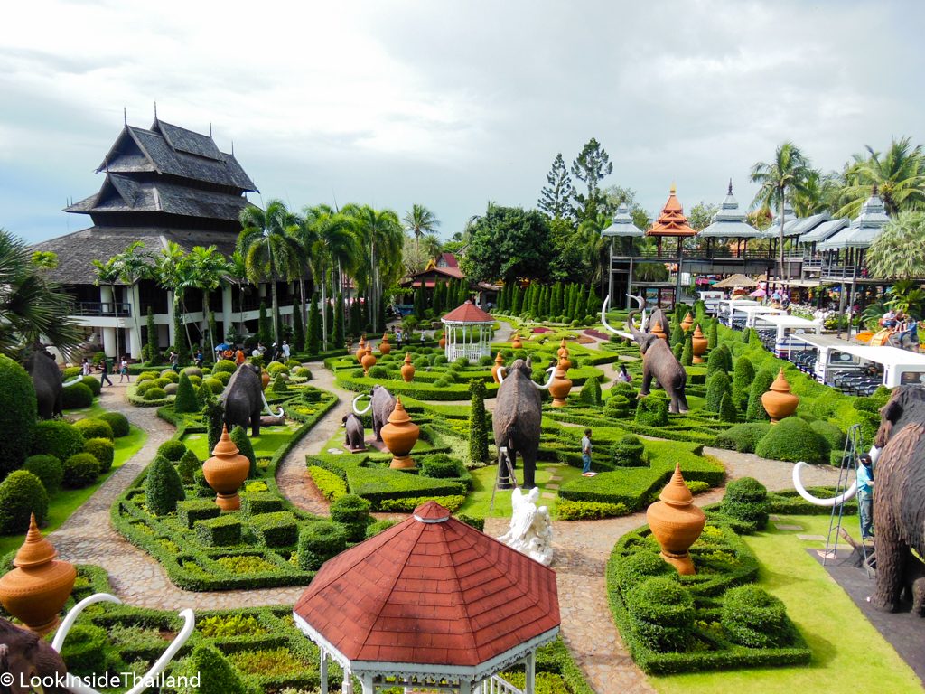 Tropical Botanical Garden with elephant and dinosaur statues 